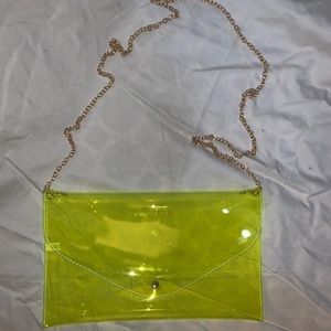 Transparent Neon green purse with gold chain.